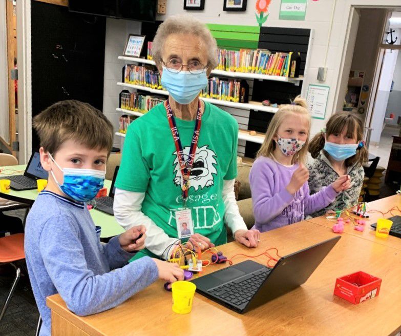 Grandma Sheral Tumilson and kids in library